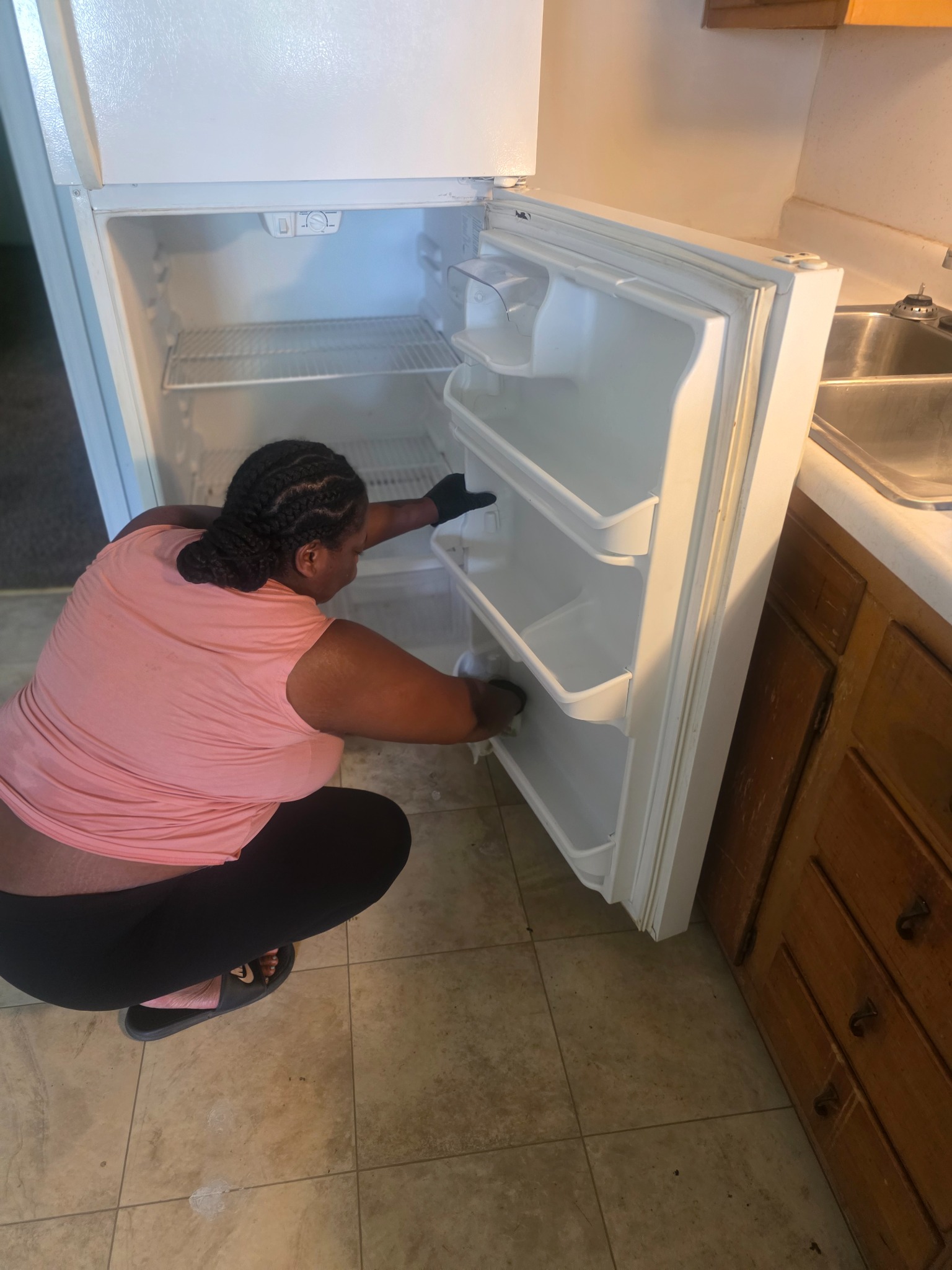 Cleaning the inside of a refrigerator as part of a home cleaning service