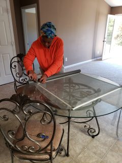 Repairing a framed household screen on a work table